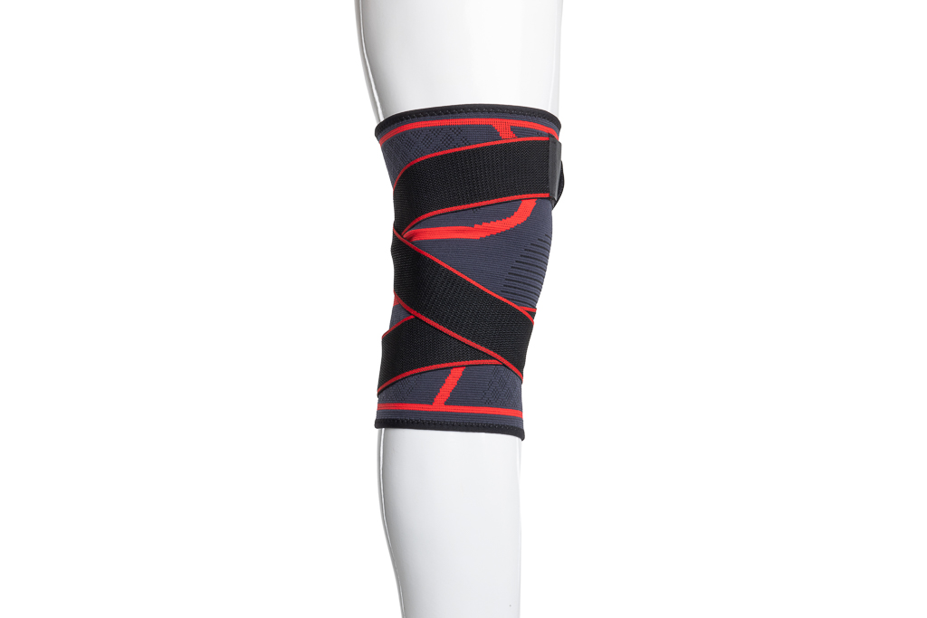 Bandage de genou de soutien avec une large fermeture velcro de 5 cm - noir et rouge