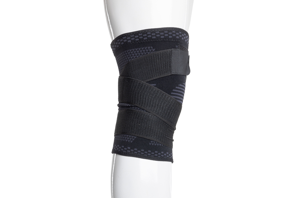 Bandage de genou de soutien avec une large fermeture velcro de 5 cm - noir